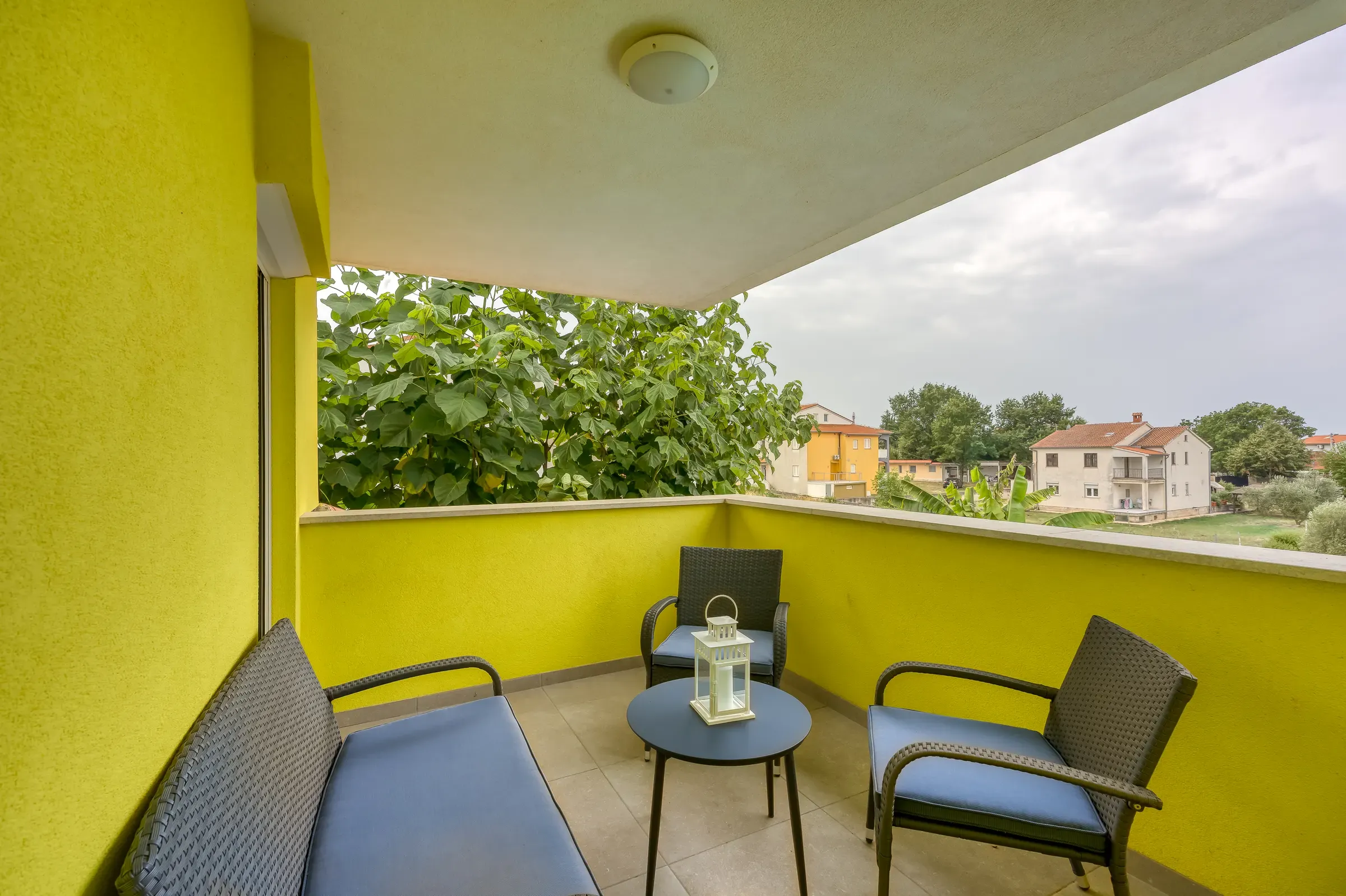 Upper balcony with seating and a view over the neighbourhood